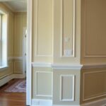 A room showcasing various styles of wall molding in a casual home environment.