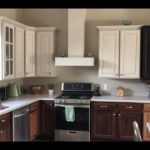 A homeowner compares custom and modular kitchen cabinets in a domestic kitchen setting